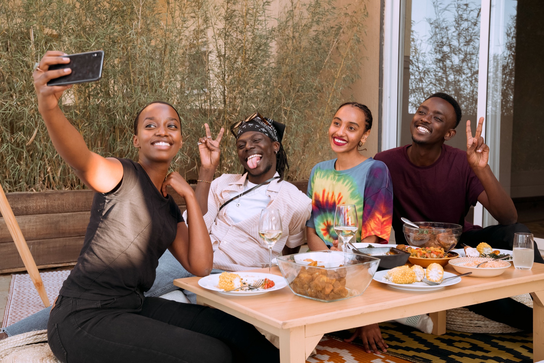 Friends enjoying a joyful meal together around a shared table