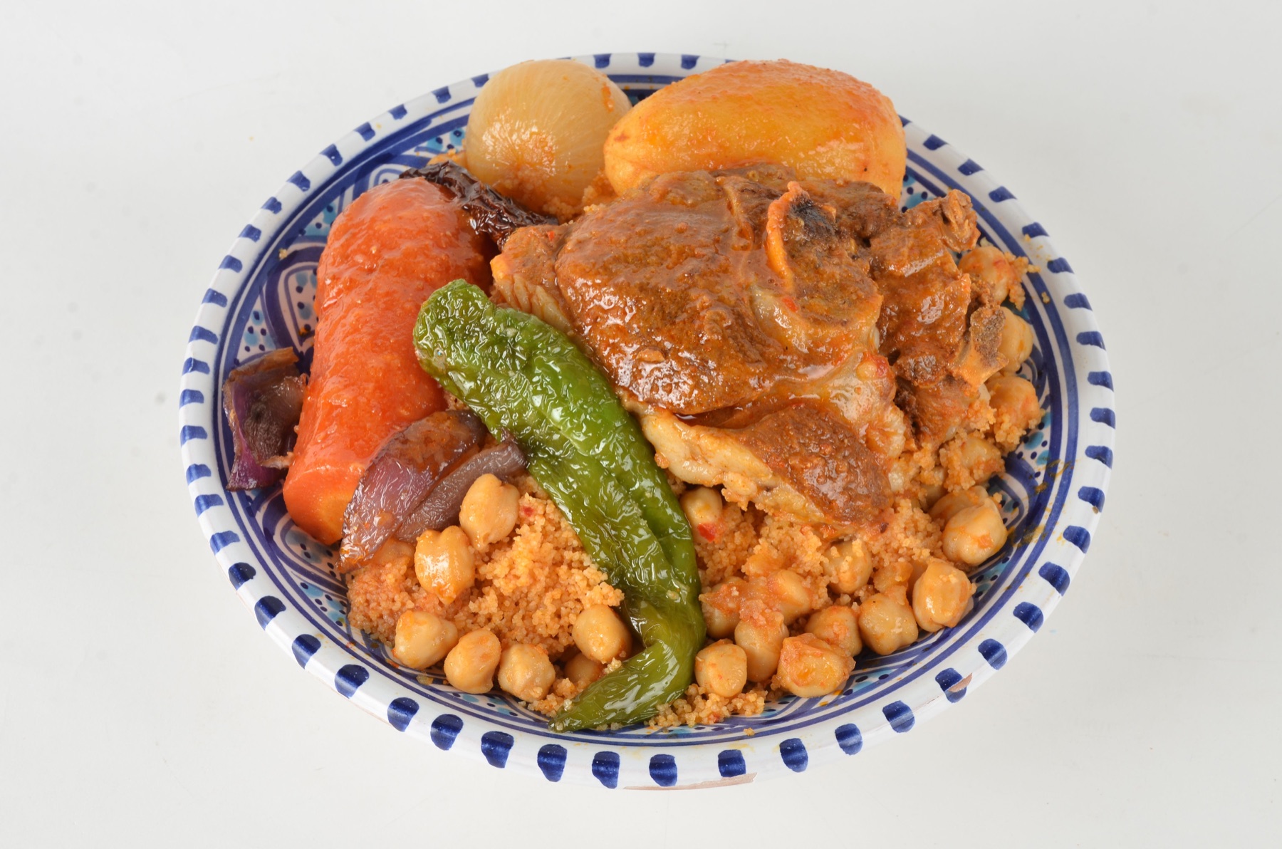 Tunisian couscous with chickpeas, vegetables and slow-cooked meat